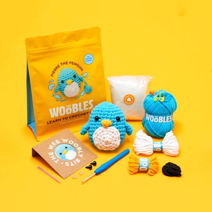 Crochet kit with supplies featuring blue penguin