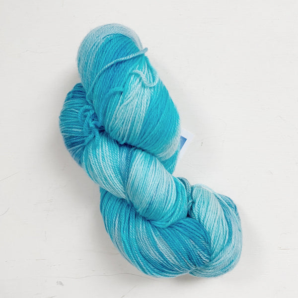 bright blue hand-dyed merino sock yarn