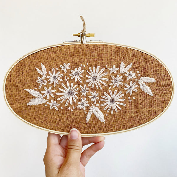 White and Tan Floral Embroidery
