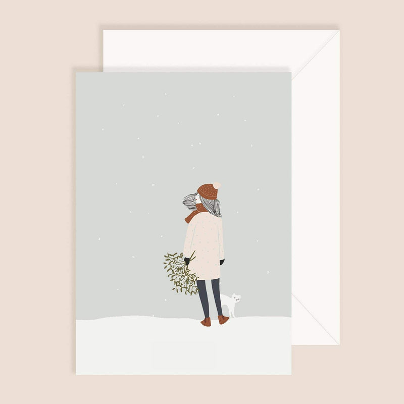 Girl with cat in winter greeting card